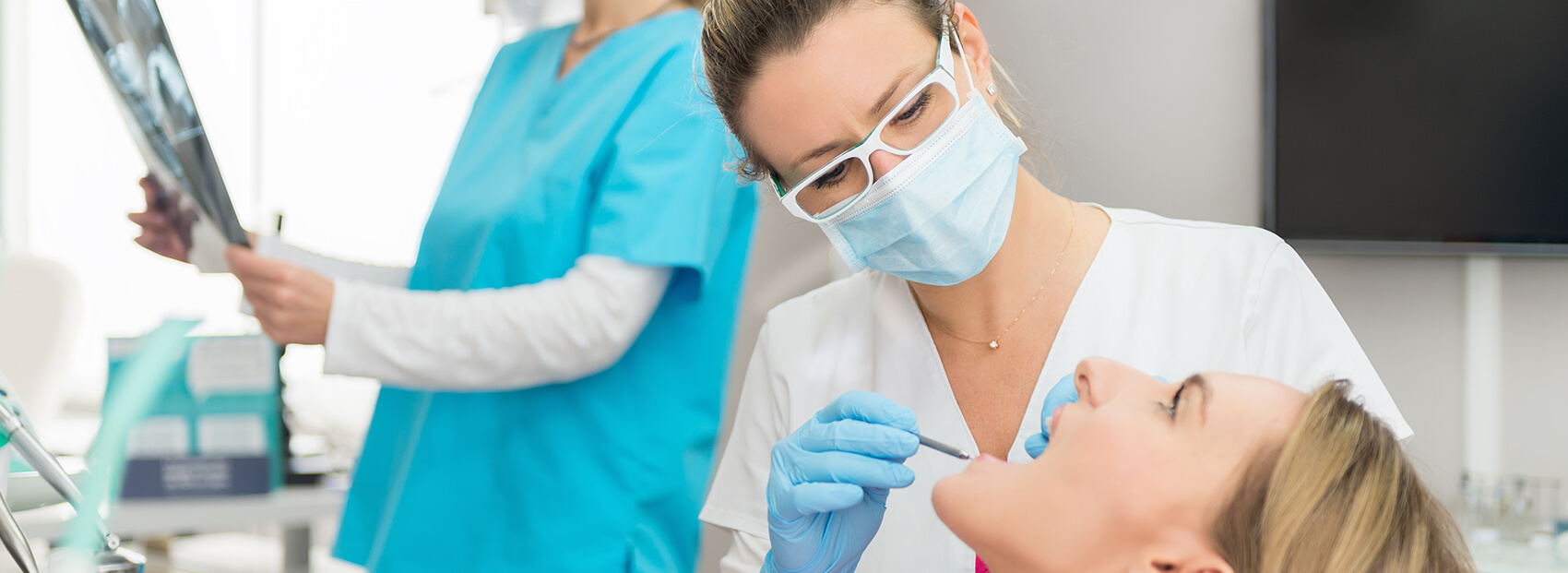 dentist examining a patient's mouth