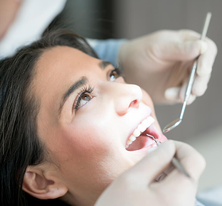 woman receiving a dental exam