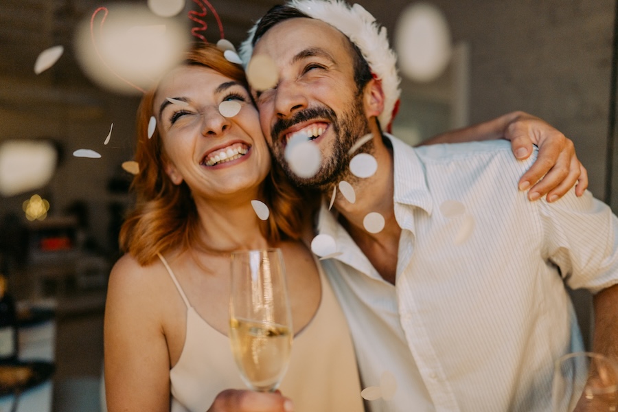 Try out cosmetic dentistry in Mabank to get a new smile for the new year. Couple celebrating new years.