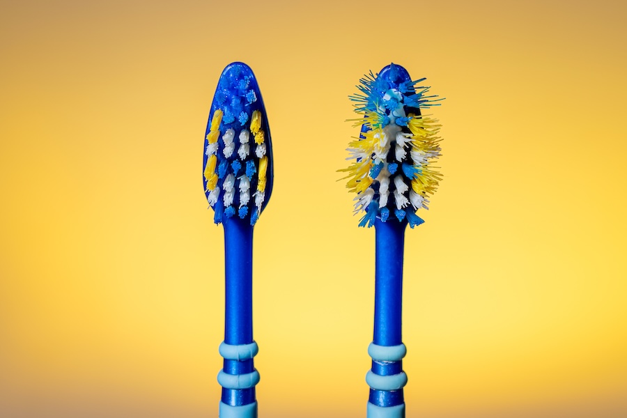 worn out toothbrush from aggressive brushing