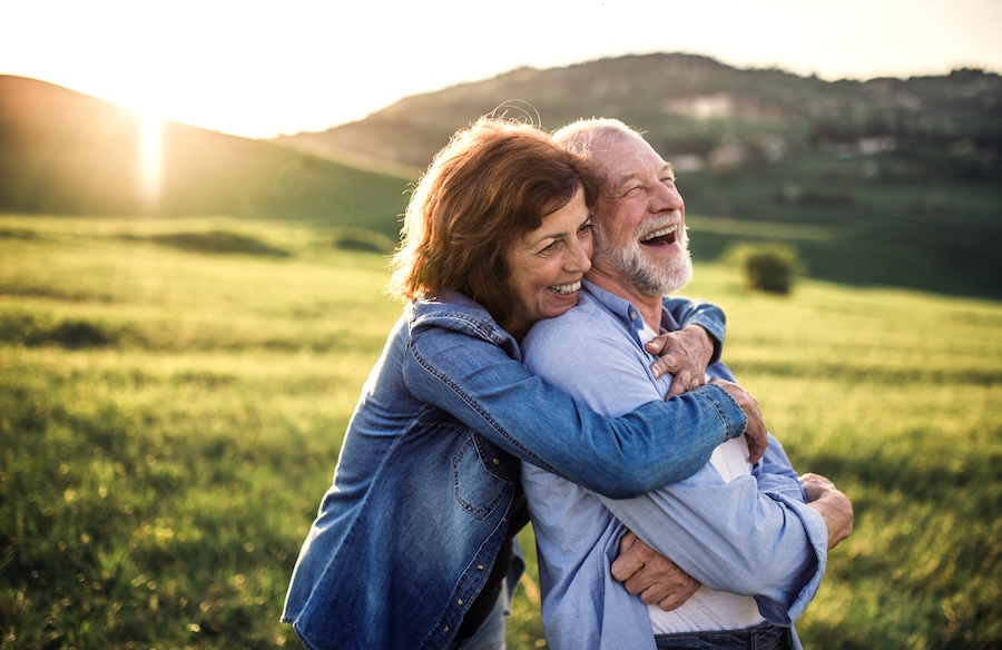 smiling senior couple, dental implants for seniors