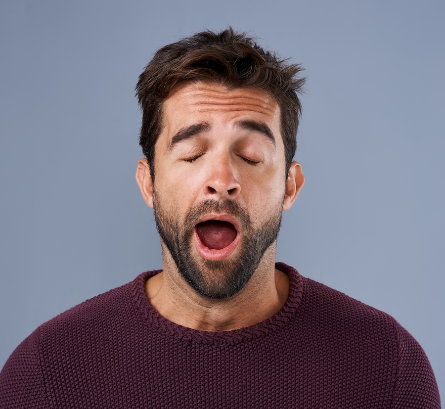 man yawning and tired after sleeping, sleep apnea treatment
