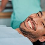 man at dental office for routine dental exam and cleaning