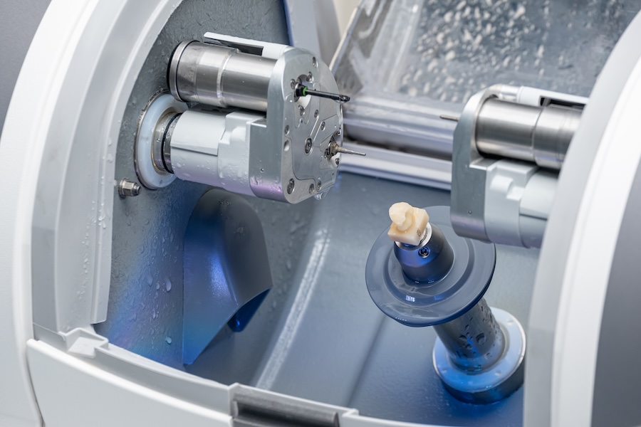 same day crown being milled in CAD CAM machine